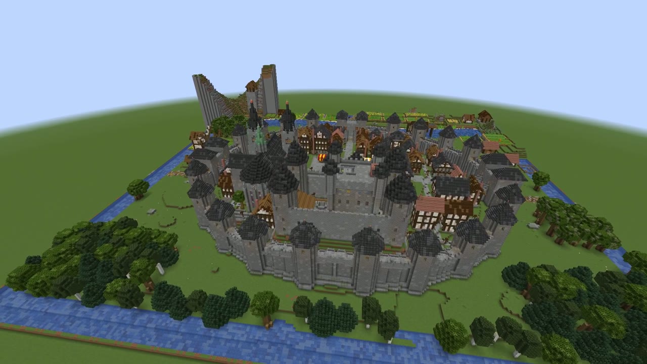 A walled medieval town with a castle on a hill above a river